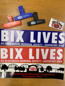 Image of Bix Jazz Society chip-clips, magnet, and bumper stickers in red, black, and blue designs